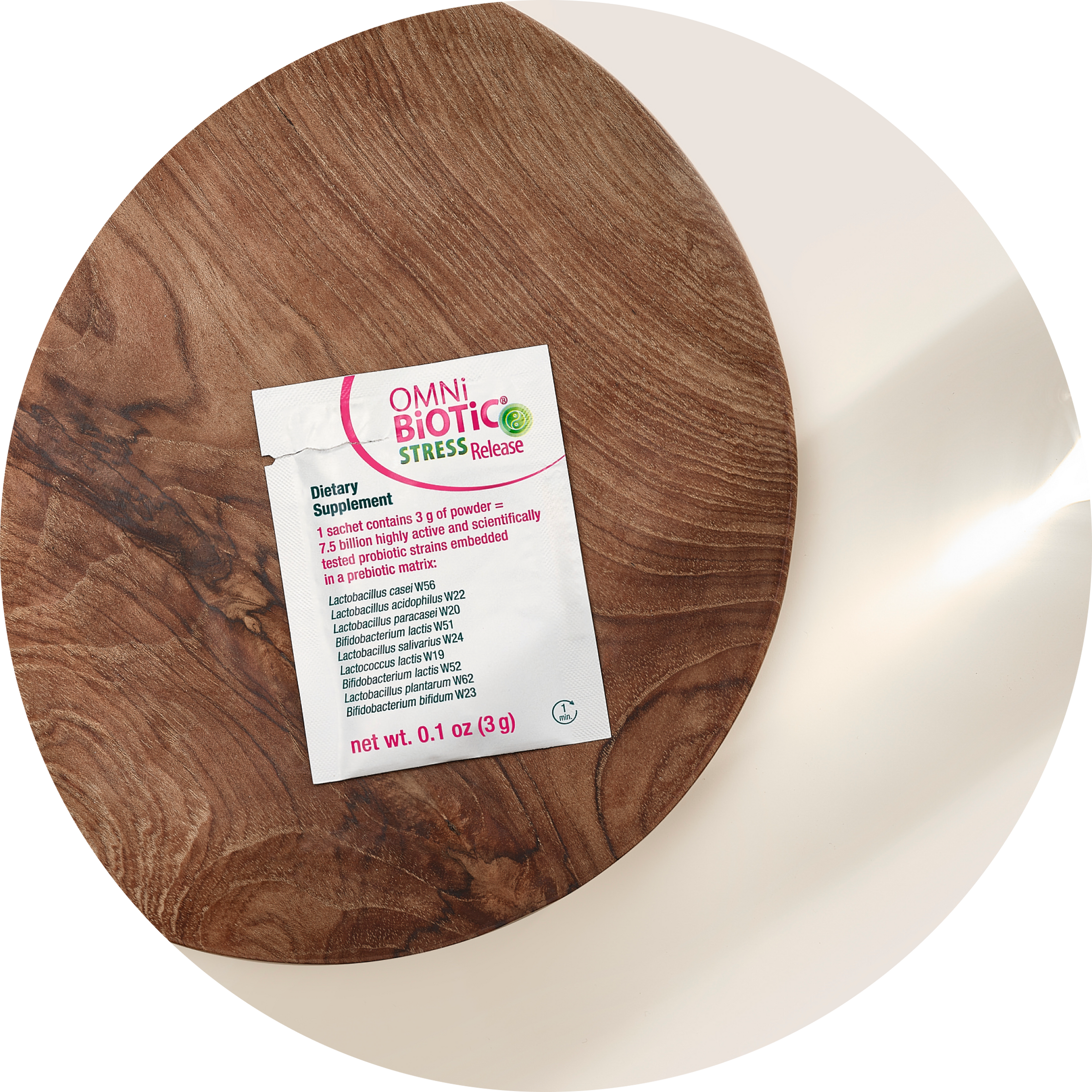 OMNi-BiOTiC Stress Release probiotic supplement packet on a wooden board