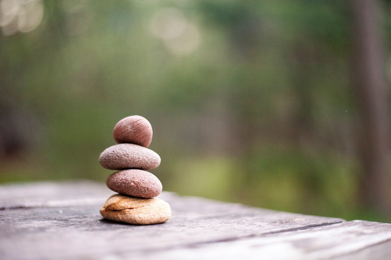 four-small-flat-rocks-balanced-in-a-stack