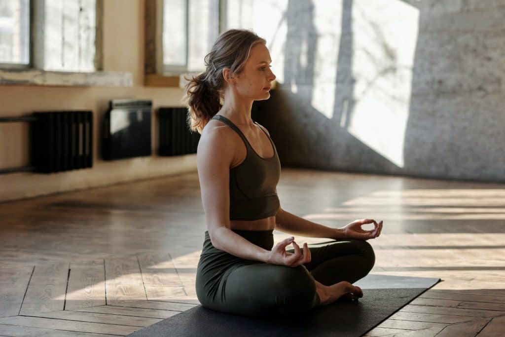 woman doing yoga pose in the morning