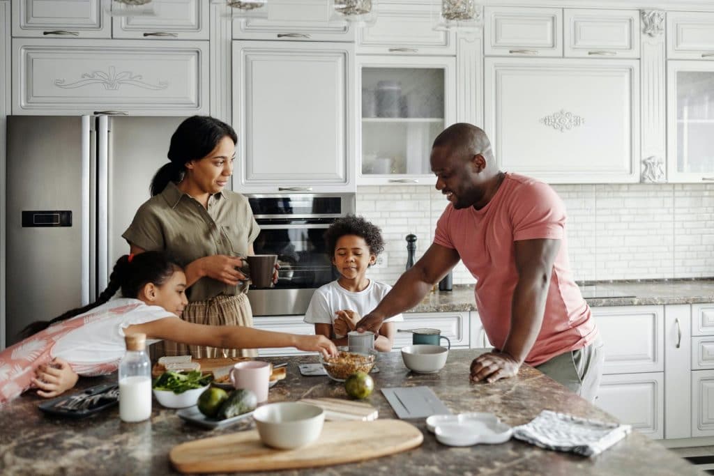 happy vegan family prepares a healthy breakfast