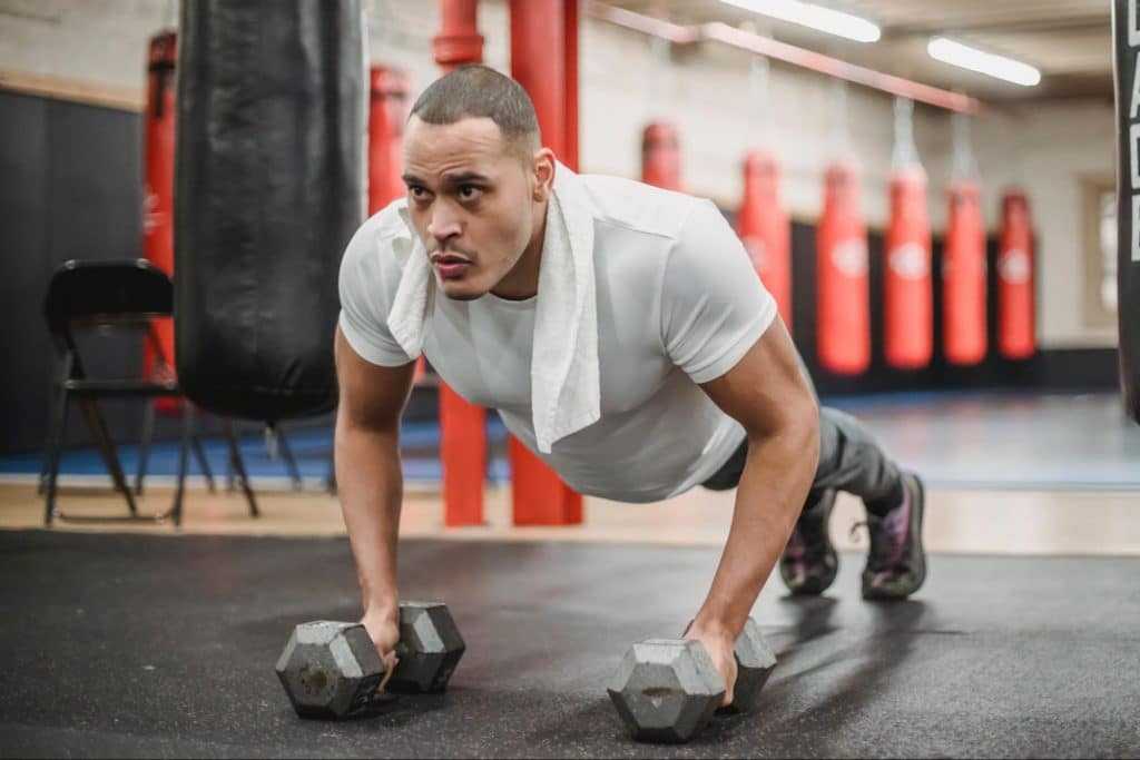 Man doing push ups at the gym.