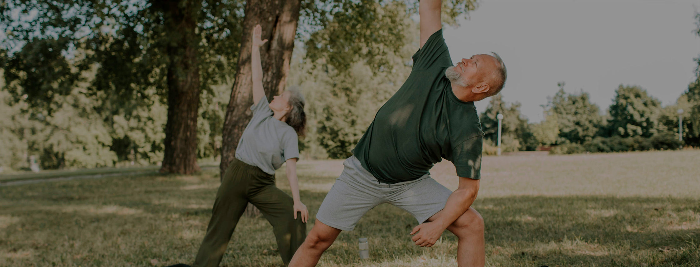 The image shows a woman & men hiking up a mountain trail, symbolizing support for metabolism and energy levels. She is surrounded by lush greenery and bright sunlight, indicating an active and healthy lifestyle