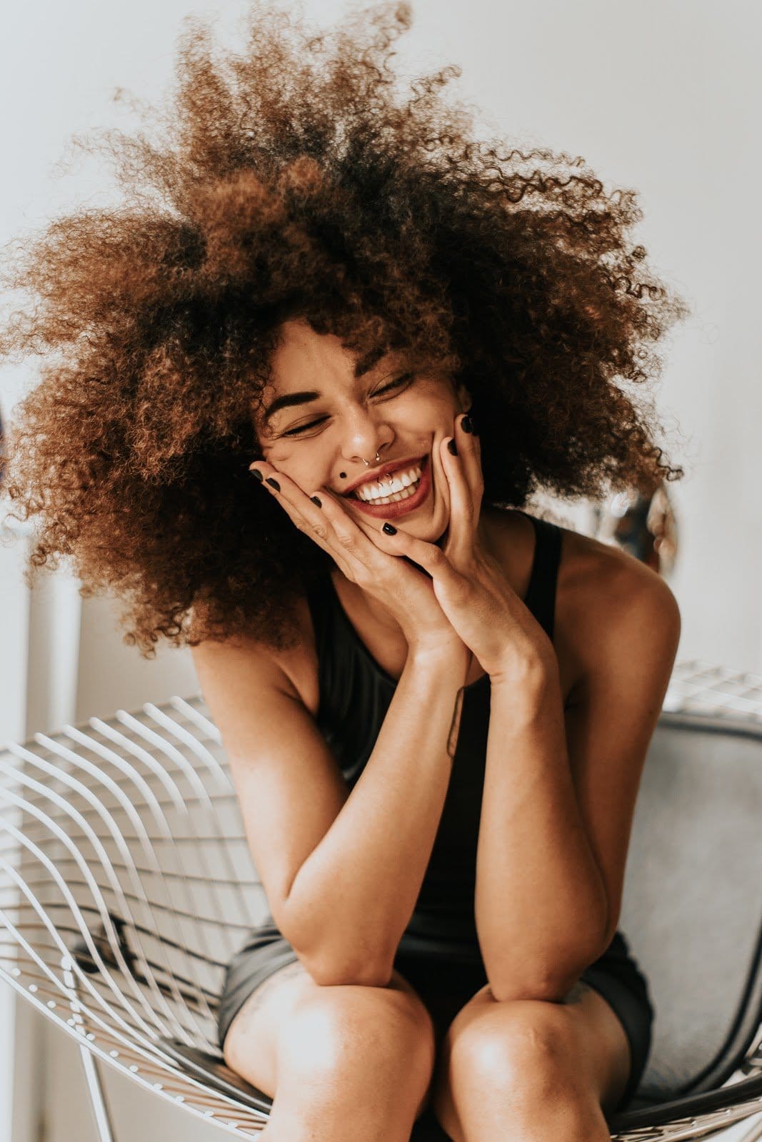 woman-sitting-and-smiling