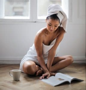 woman-sitting-on-floor-while-reading